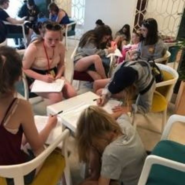 girls completing diaries